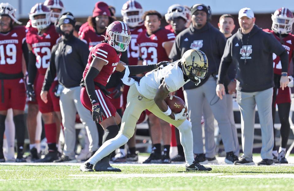 Army wide receiver Isaiah Alston (11) comes down after making a one-handed catch over Massachusetts cornerback Jordan Mahoney (7). DANNY WILD/USA TODAY Sports
