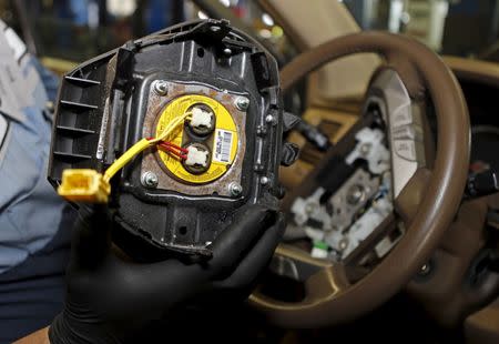 FILE PHOTO: A recalled Takata airbag inflator removed it from a Honda Pilot is shown at the AutoNation Honda dealership service department in Miami, Florida, United States on June 25, 2015. REUTERS/Joe Skipper/File Photo