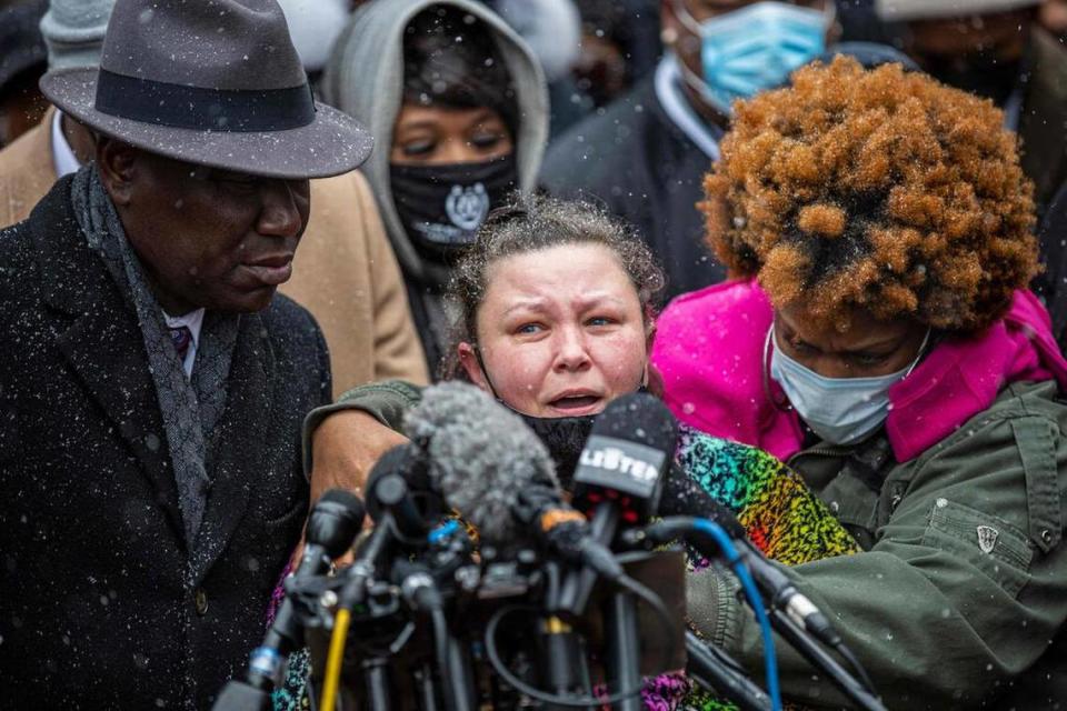 Katie Wright, mother of Daunte Wright (C), with Floyd family lawyer, Attorney Ben Crump (L), and Wright family members (R) speaks during press conference at the Hennepin County Government Center in Minneapolis, Minnesota on April 13, 2021. - Protests broke out April 11, 2021 night after US police fatally shot a young Black man in a suburb of Minneapolis -- where a former police officer is currently on trial for the murder of George Floyd. Hundreds of people gathered outside the police station in Brooklyn Center, northwest of Minneapolis. Police fired teargas and flash bangs at the demonstrators, according to an AFP videojournalist at the scene. (Photo by Kerem Yucel / AFP) (Photo by KEREM YUCEL/AFP via Getty Images)