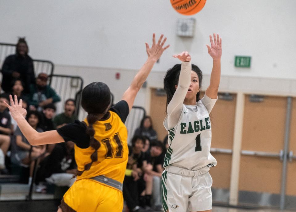McNair's Kalysa Phanhsavang shoots a 3-pointer over Stagg's Janae Moreno during a SJAA girls varsity basketball game against Stagg at McNair High in Stockton on Feb 1. 2024.
