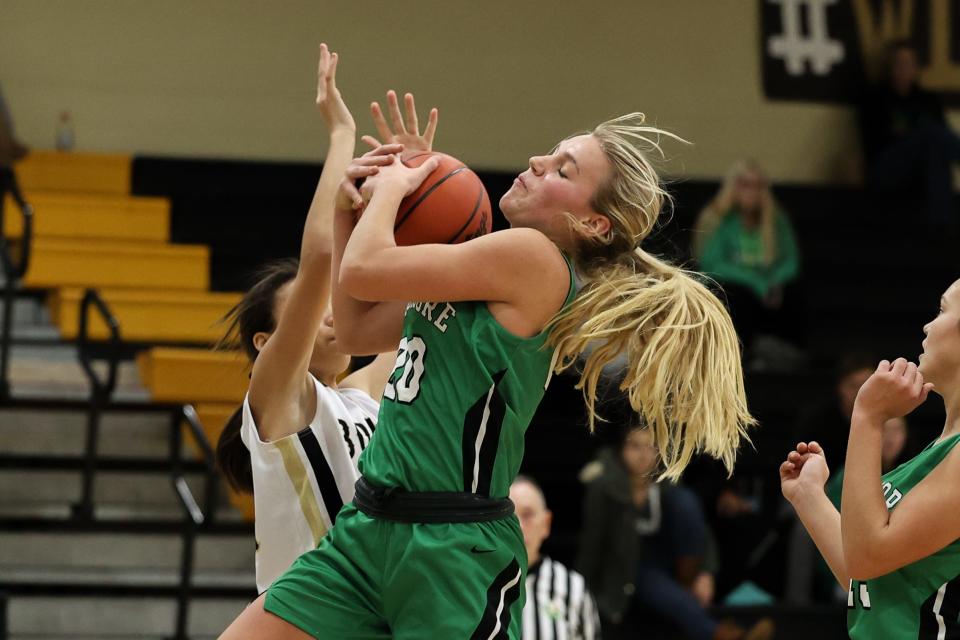 Mogadore senior Amber Morris fights for a rebound during Monday night’s game against the Windham Bombers.