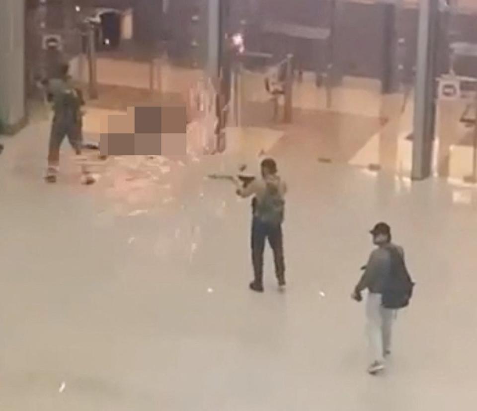 Men dressed in military fatigues calmly walked through the Crocus City Hall venue, opening fire (via REUTERS)