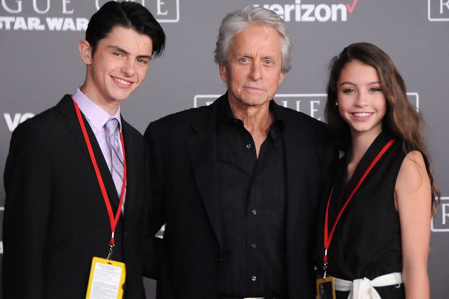<p>Barry King/Getty</p> Michael Douglas with his kids Dylan and Carys in 2016.