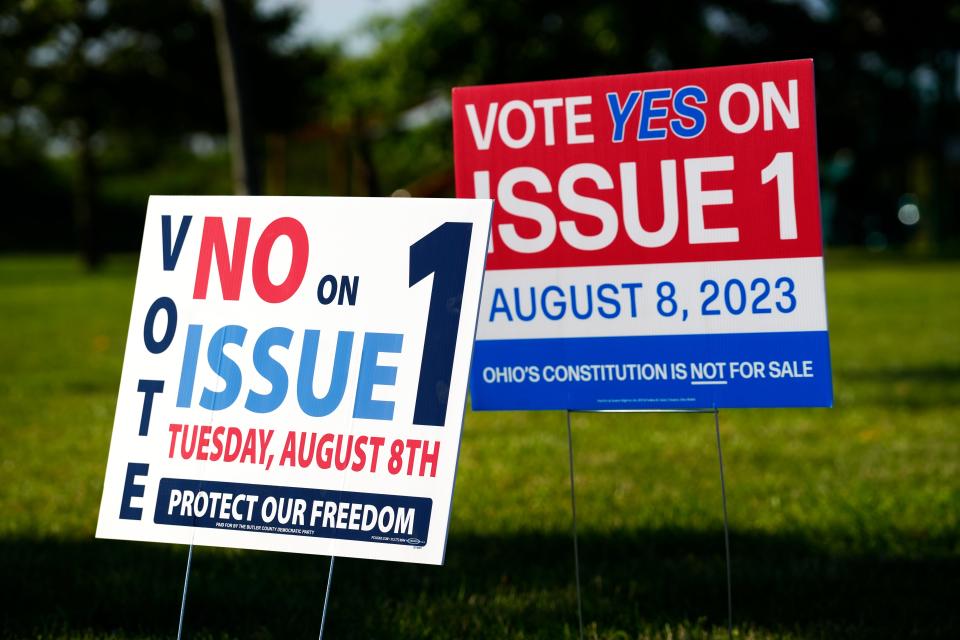 Signs for and against Issue 1 at the VOA Reagan Lodge polling location in West Chester, Tuesday, August 8, 2023. Turnout was strong at this location that has 4,000 registered voters. The special election would require 60% of the vote to enact new constitutional amendments instead of a simple majority. 