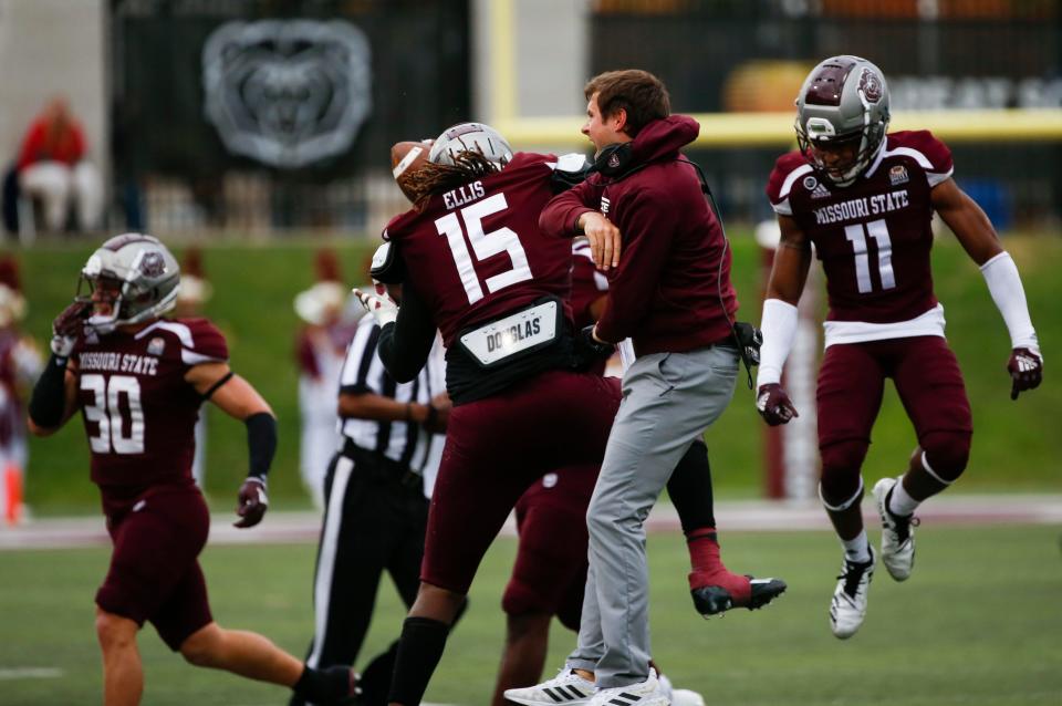 Missouri State Bears defensive coordinator Ryan Beard celebrates with the team after a touchdown as the Bears face the Western Illinois Leathernecks at Plaster Stadium on Saturday, October 29, 2022. 