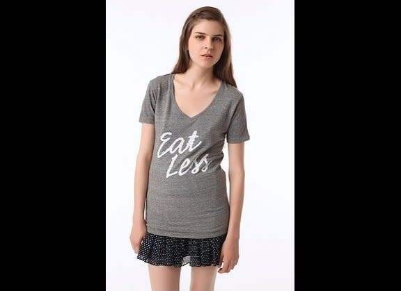 In June 2010, Urban Outfitters released this t-shirt with this description: "Eat less or more or however much you'd like in this seriously soft knit tee cut long and topped with a v-neck." They should have printed that whole description instead of just "eat less" which seems to promote an unhealthy lifestyle and body image.     (<a href="http://www.huffingtonpost.com/2010/06/03/eat-less-urban-outfitters_n_598904.html" target="_hplink">Urban Outfitters</a>)