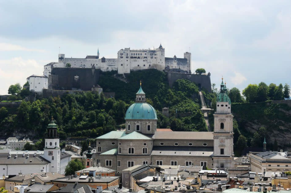 Fortress Hohensalzburg and Salzburg cathedral in the old town center.