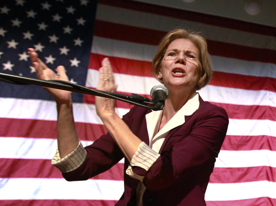 Democratic candidate for the U.S. Senate, Elizabeth Warren addresses an audience during a campaign rally at a high school in Braintree, Mass., Sunday, Nov. 4, 2012. (AP Photo/Steven Senne)