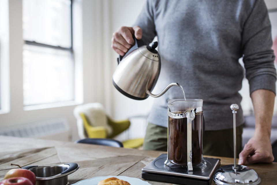 person making coffee