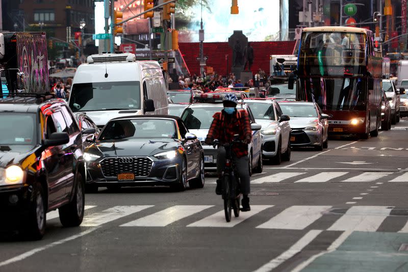 FILE PHOTO: Vehicles sit in a line of traffic in Times Square in Manhattan in New York City