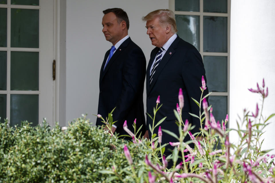 President Donald Trump walks with Polish President Andrzej Duda to the Oval Office of the White House, Tuesday, Sept. 18, 2018, in Washington. (AP Photo/Evan Vucci)
