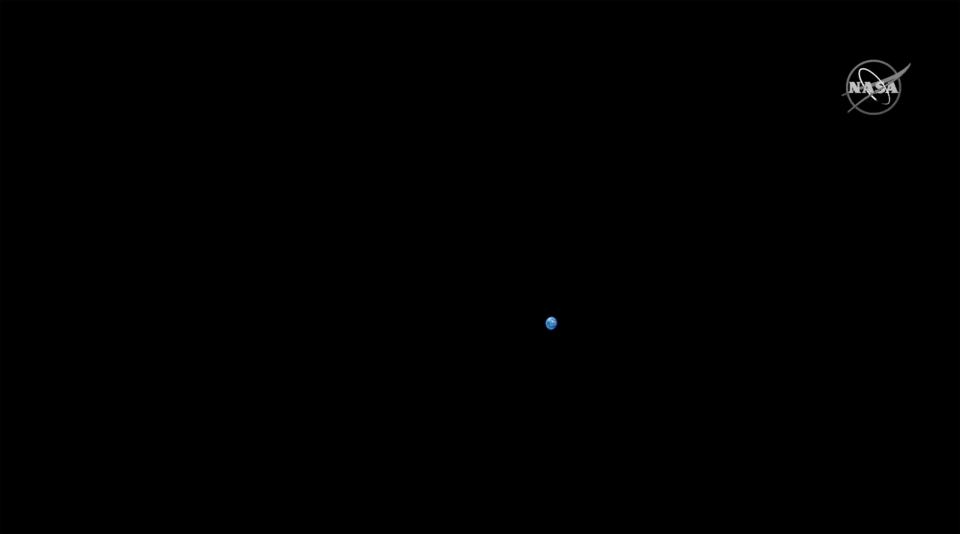 An image of Earth taken from NASA's Orion spacecraft while behind the moon on Monday.