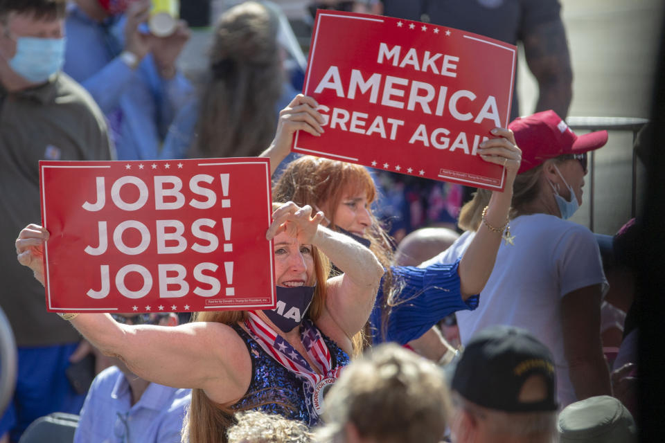 Trump supporters as President Donald Trump speaks at an event at the Wittman Regional Airport Monday, Aug. 17, 2020, in Oshkosh, Wis. (AP Photo/Mike Roemer)
