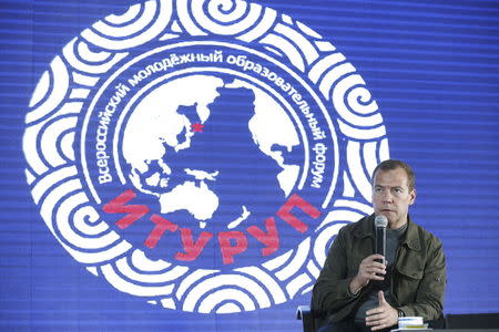 Russia's Prime Minister Dmitry Medvedev speaks as he attends the all-Russian youth educational forum "Iturup" in Kurilsk during his visit to Iturup Island, one of four islands known as the Southern Kurils in Russia and the Northern Territories in Japan, August 22, 2015. REUTERS/Dmitry Astakhov/RIA Novosti/Pool