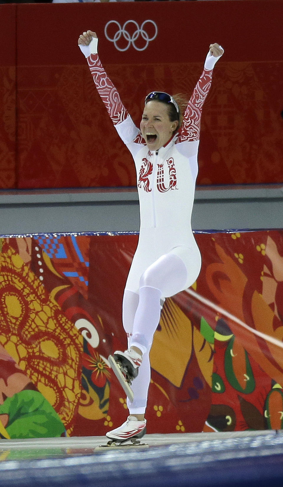 Russia's Olga Graf celebrates after finishing her race during the women's 3,000-meter speedskating competition at the 2014 Winter Olympics, Sunday, Feb. 9, 2014, in Sochi, Russia. (AP Photo/David J. Phillip )