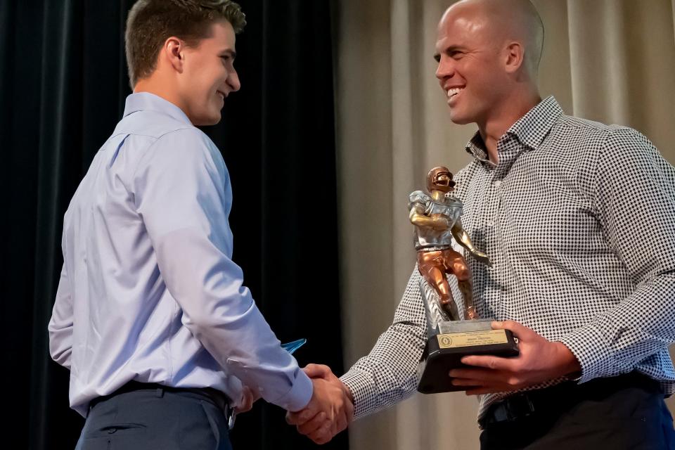 Lafayette Jeff graduate Brady Preston is awarded the National Football Foundation Scholar-Athlete of the Year trophy from Clayton Richard at Purdue Memorial Union on June 12, 2022.