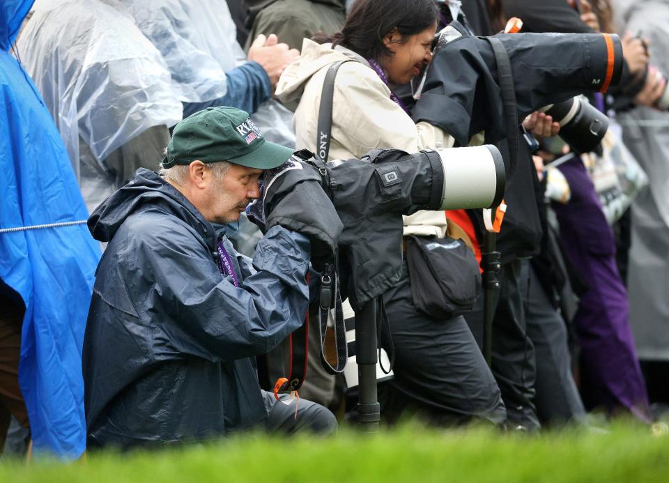 Shawn Dowd at work covering the PGA Championship at Oak Hill Country Club.