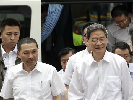 Zhang Zhijun (R), director of China's Taiwan Affairs Office, arrives with New Taipei City Deputy Mayor Hou You-yi, at the labour activity centre in New Taipei City June 26, 2014. REUTERS/Pichi Chuang