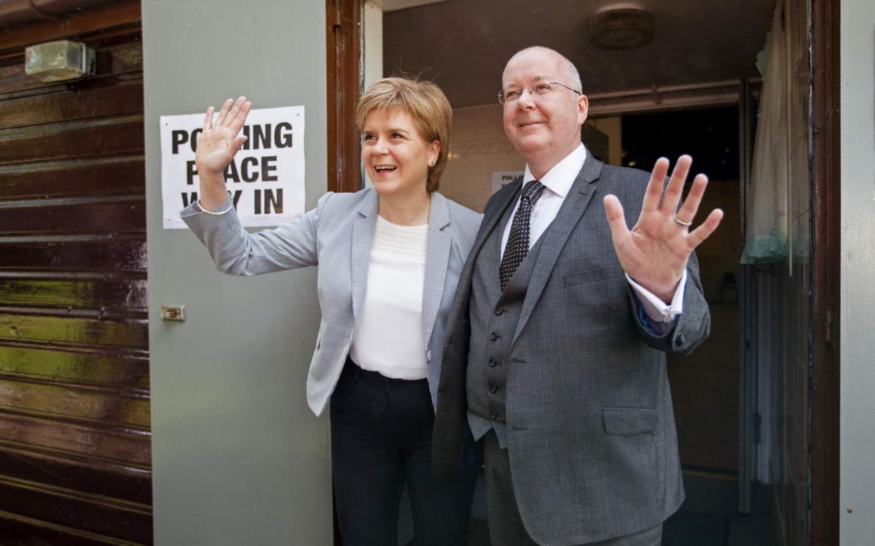 Nicola Sturgeon and Peter Murrell will both give evidence to the Holyrood inquiry - ROBERT PERRY/AFP