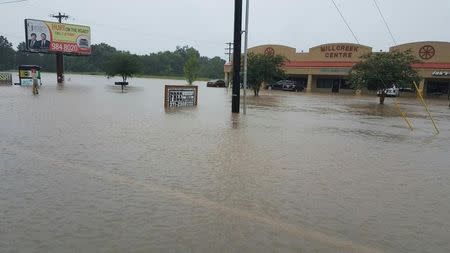 Verot School Rd is seen covered in floodwaters in this handout picture taken by the Louisiana Department of Transportation and Development in Lafayette Parish, Louisiana, U.S. August 12, 2016. Louisiana Department of Transportation and Development/Handout via Reuters