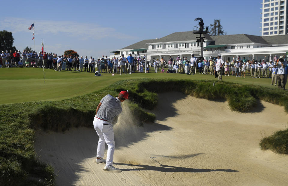 FILE - Cameron Champ, of the United States, hits out of a bunker on the ninth hole during the Walker Cup golf matches at Los Angeles Country Club on Sept. 10, 2017, in Los Angeles. The Los Angeles Country Club is opening itself to the world's largest golf audiences with the arrival of the 123rd U.S. Open next week. For its first century of existence, the club and its two courses were rarely seen by anyone except its wealthy members. (AP Photo/Mark J. Terrill, File)