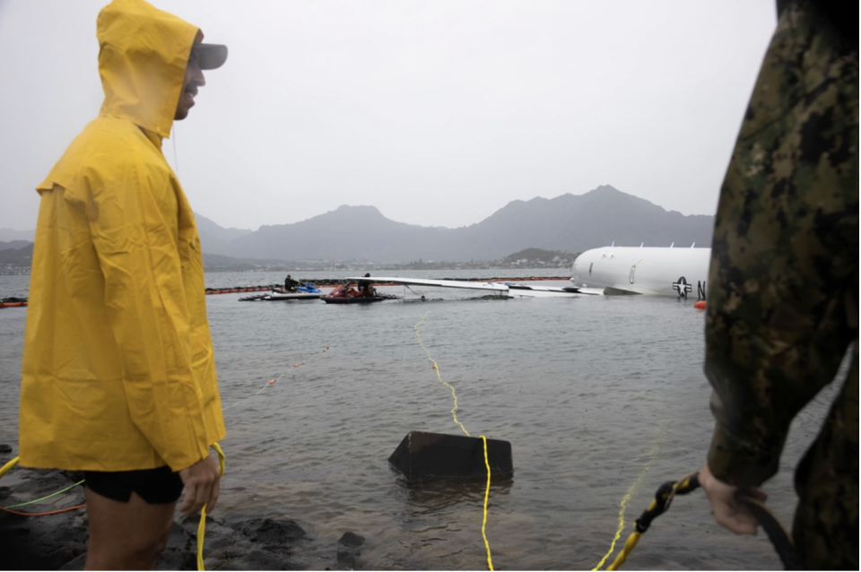 The Navy released a $1.5 million plan to remove a surveillance plane that overshot a runway at a military base in Hawaii and splashed into Kaneohe Bay, / Credit: U.S. Navy