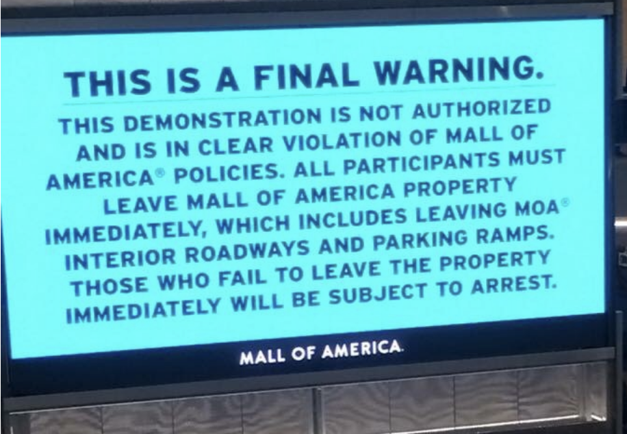 Sign at Mall of America issuing a final warning against unauthorized demonstration with threat of arrest for non-compliance
