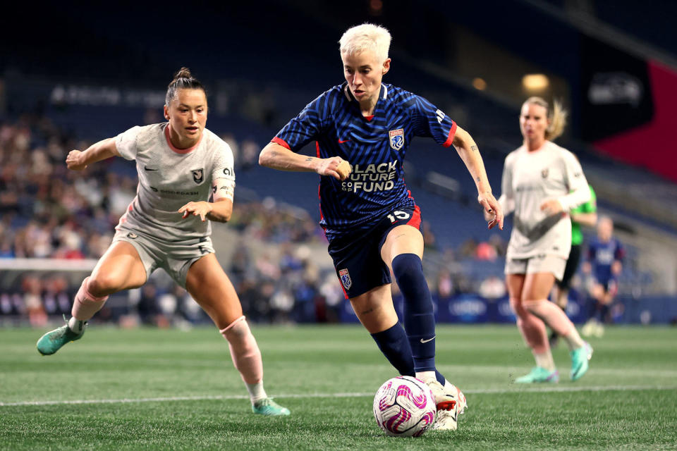  Megan Rapinoe controls the ball on the field. (Steph Chambers / Getty Images)