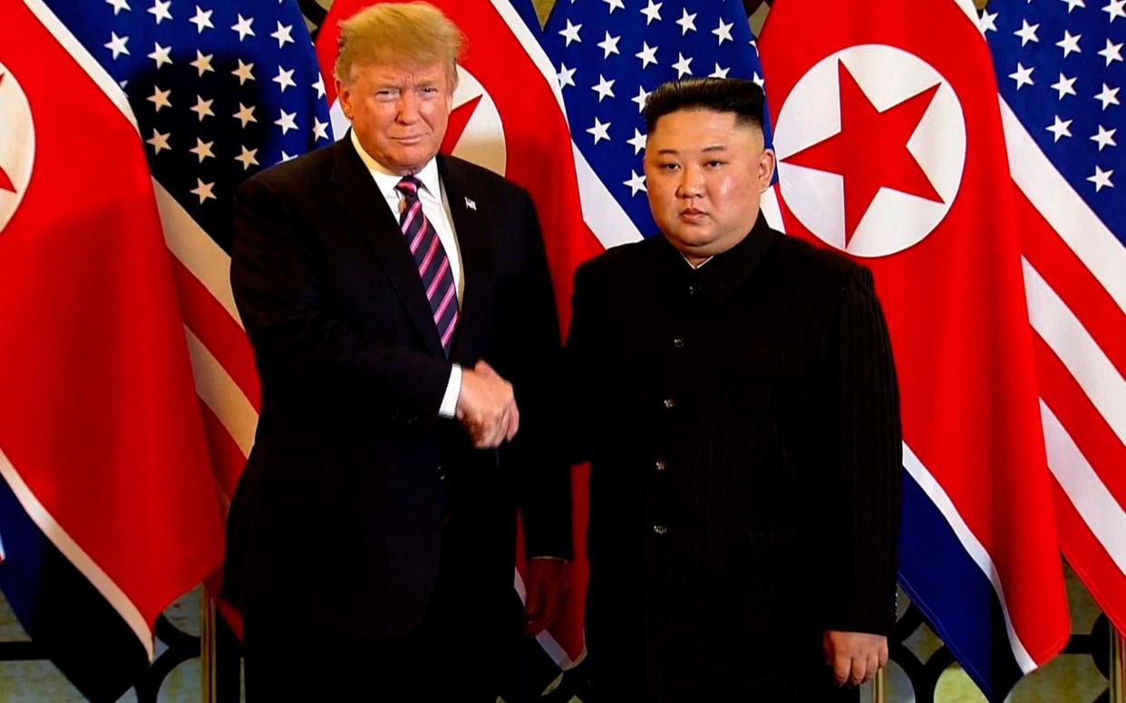 U.S. President Donald Trump, left, meets North Korean leader Kim Jong Un at Metropole Hotel in Hanoi, Vietnam - Host Broadcast