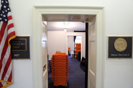 Stacks of moving crates sit in a U.S. Congressional office weeks before the end of the current term, as dozens of outgoing and incoming members of Congress move into and out of Washington as votes on a potential federal government shutdown loom, on Capitol Hill in Washington, U.S., December 17, 2018. REUTERS/Jonathan Ernst