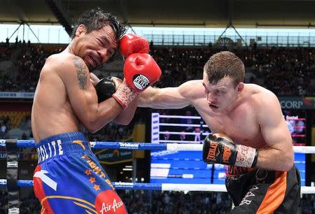 Boxing - Manny Pacquiao v Jeff Horn - WBO World Welterweight Title - Brisbane, Australia - July 2, 2017. Jeff Horn of Australia punches Manny Pacquiao of the Philippines. AAP/Dave Hunt/via REUTERS