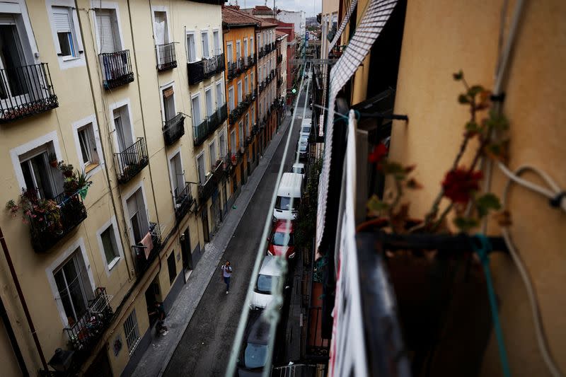 A person walks on the street of Cajamarca's rented flat in Madrid
