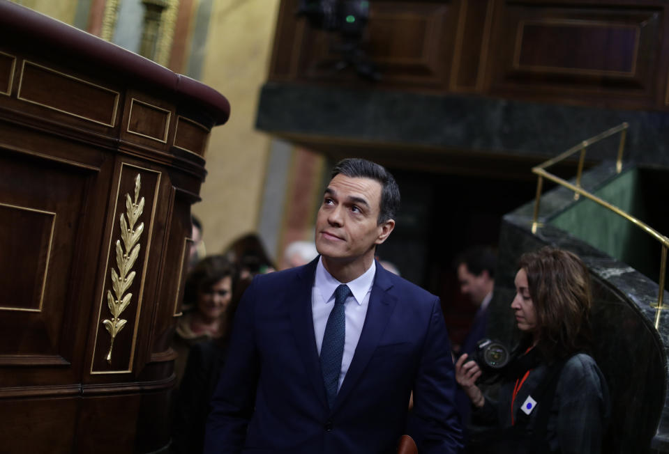 Spain's caretaker Prime Minister Pedro Sanchez arrives at the Spanish Parliament in Madrid, Spain, Sunday, Jan. 5, 2020. Sanchez is not expected to clinch an absolute majority during a first round of voting on Sunday but the Socialists insist they have the votes needed to get the required simple majority in a second vote Tuesday to put Sanchez back in the Moncloa Palace. (AP Photo/Manu Fernandez)