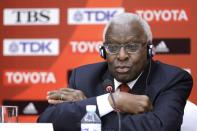 FILE PHOTO: Outgoing President of IAAF Lamine Diack attends a news conference in Beijing