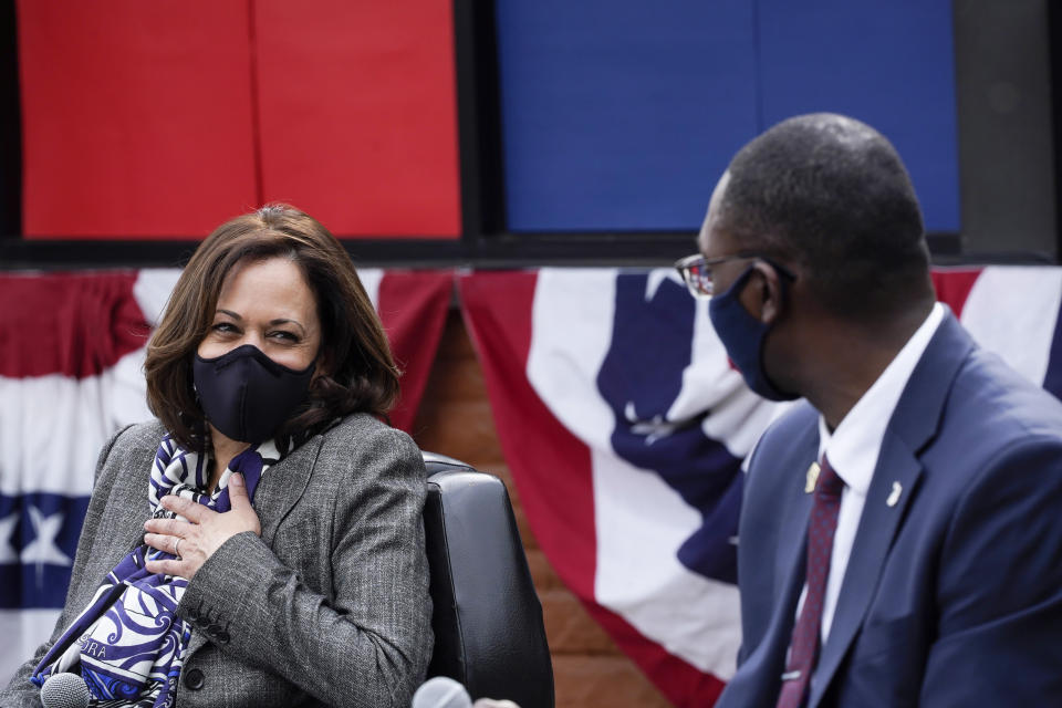 Democratic vice presidential candidate Sen. Kamala Harris, D-Calif., listens to Michigan Lt. Governor Garlin Gilchrist II at Headliners Barbershop in Detroit, Tuesday, Sept. 22, 2020. (AP Photo/Paul Sancya)