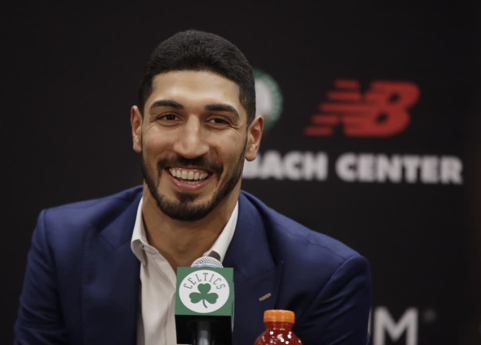 Newly acquired Boston Celtics center Enes Kanter smiles during a news conference at the Celtics' basketball practice facility, Wednesday, July 17, 2019, in Boston. (AP Photo/Elise Amendola)