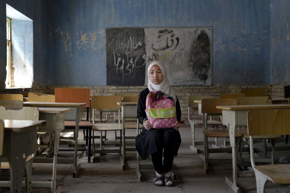 Fereshteh, 11, a Hazara Shiite student poses in her classroom in Kabul, on April 23, 2022. (Ebrahim Noroozi / AP)