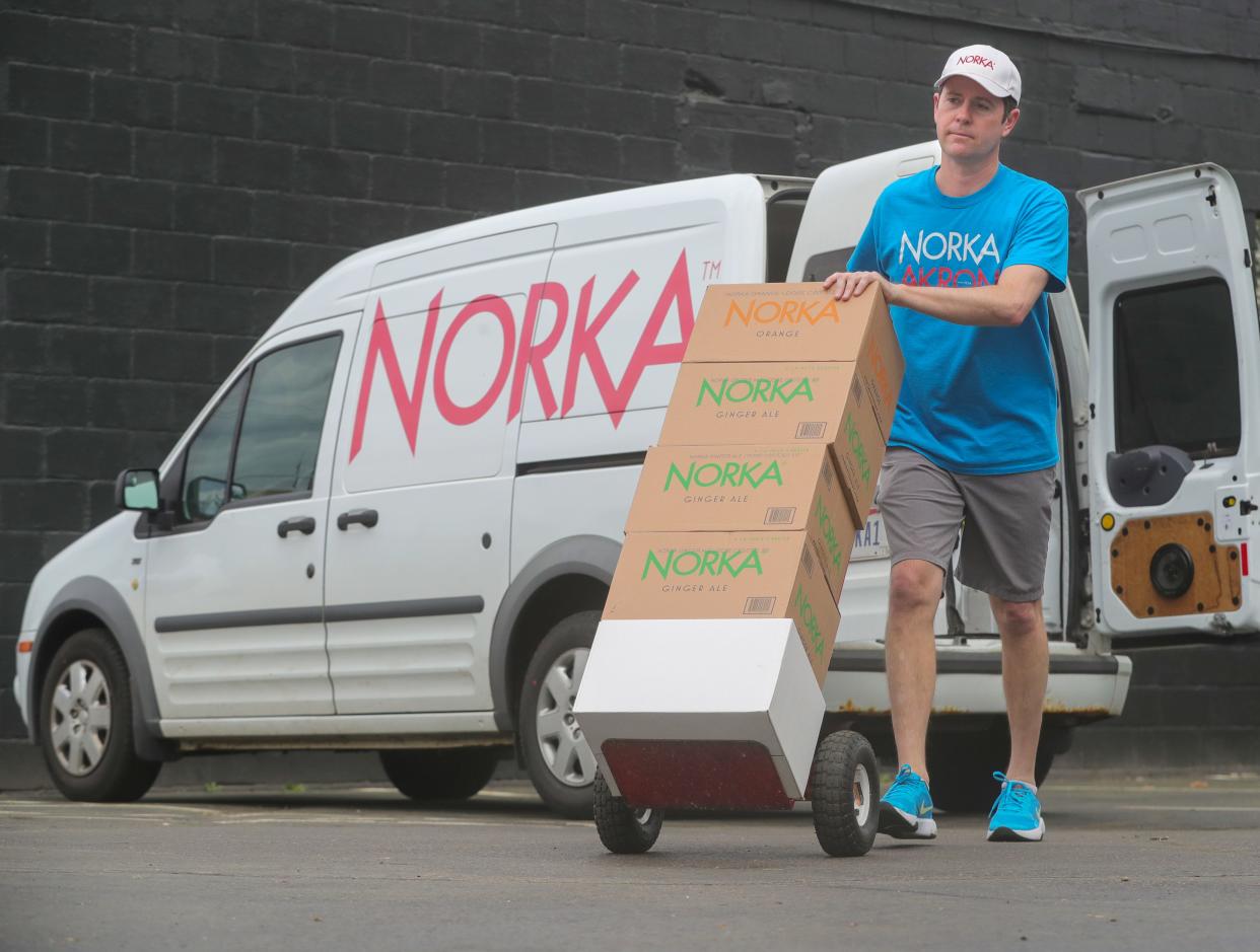 NORKA President Michael Considine delivers cases of soft drinks to HiHo Brewing Company in Cuyahoga Falls.