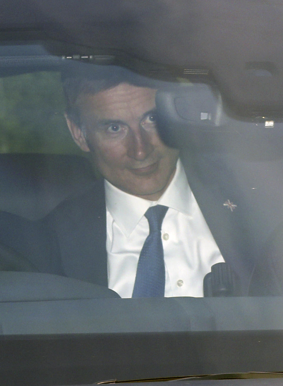 Conservative party leadership contender Jeremy Hunt arrives at the television studios ahead of a scheduled live television debate for the Conservative Party leadership candidates, in London, Sunday June 16, 2019. Five out of the six candidates will appear in the first TV debate, with Boris Johnson declining to take part, although other candidates accuse him of trying to avoid scrutiny. (Yui Mok/PA via AP)