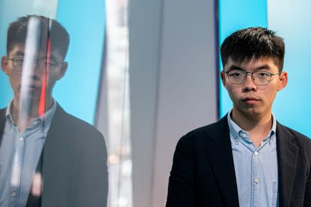 FILE PHOTO: Hong Kong pro-democracy activist Joshua Wong poses during an interview at the Reuters New York office