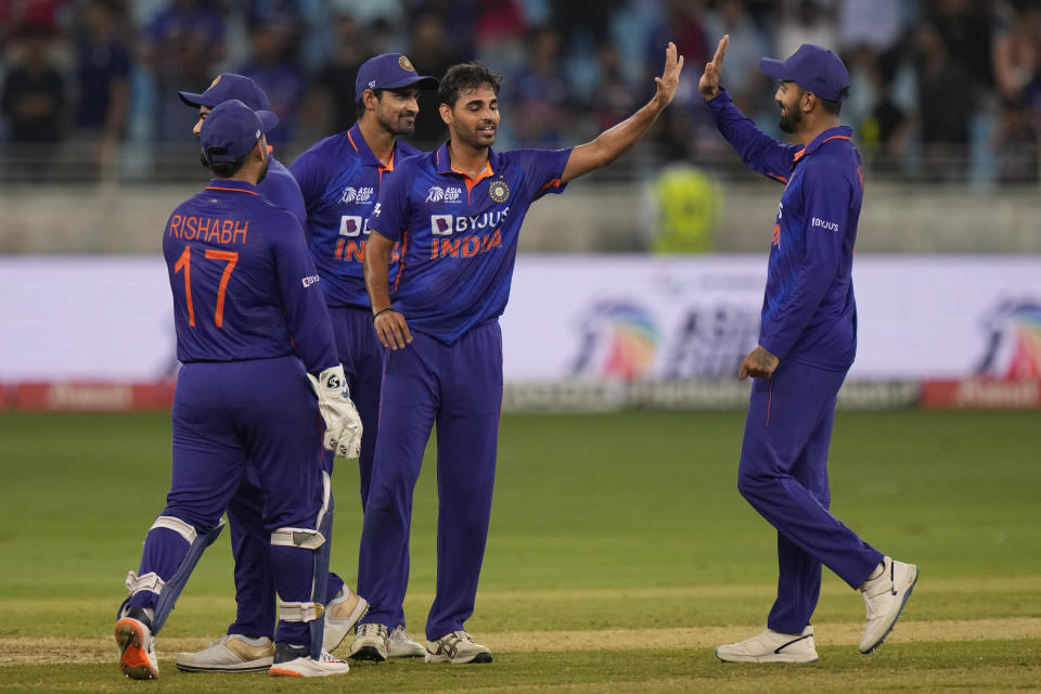 India's Bhuvneshwar Kumar, second right, celebrates with teammates the dismissal of Afghanistan's Najibullah Zadran during the T20 cricket match of Asia Cup between India and Afghanistan, in Dubai, United Arab Emirates, Thursday, Sept. 8, 2022. (AP Photo/Anjum Naveed)