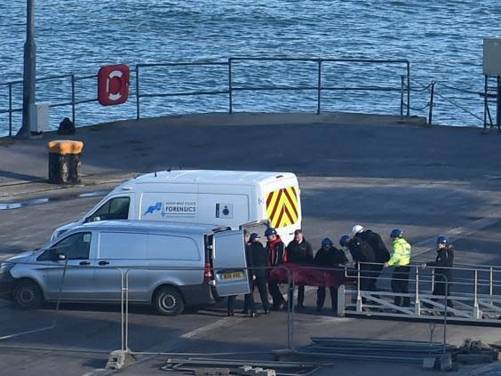 A body is taken off the Geo Ocean III, recovered from the wreckage of the plane carrying Emiliano Sala at Weymouth harbour (Getty)