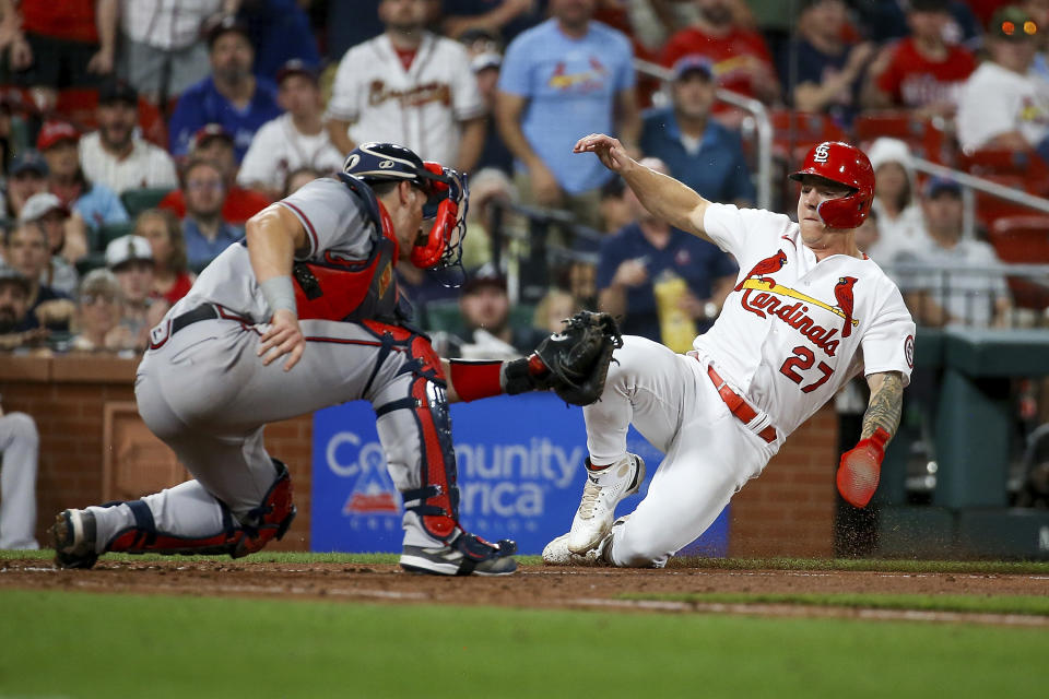 St. Louis Cardinals' Tyler O'Neill is tagged out at home by Atlanta Braves catcher Sean Murphy during the seventh inning of a baseball game Tuesday, April 4, 2023, in St. Louis. (AP Photo/Scott Kane)