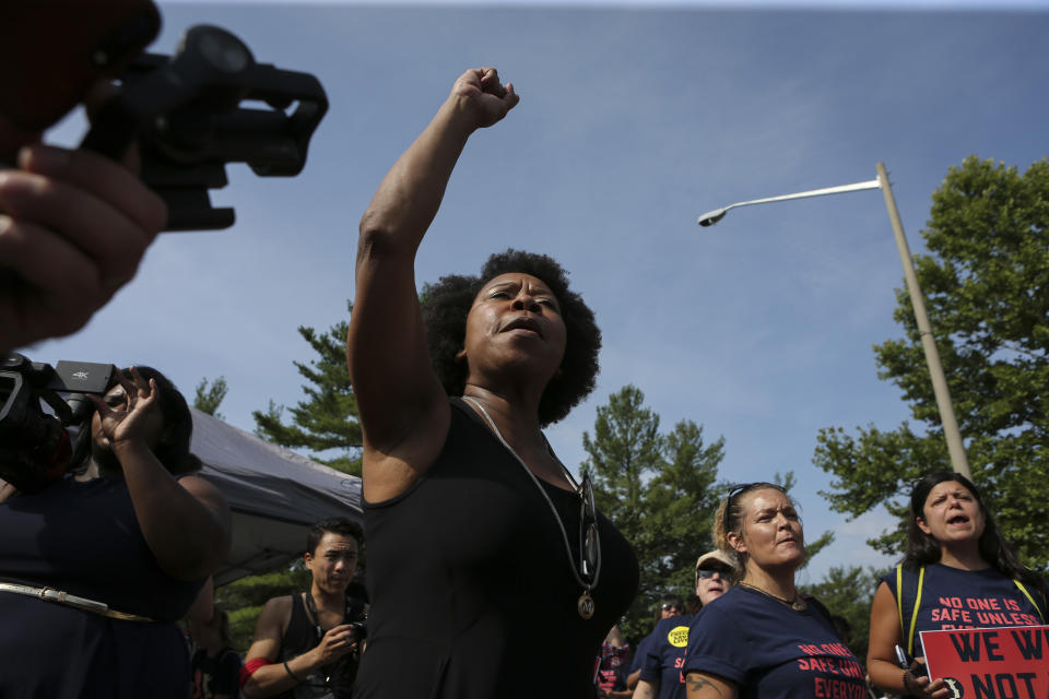 A woman protests in front of the National Rifle Association headquarters in Fairfax, Virginia, July 14, 2017.