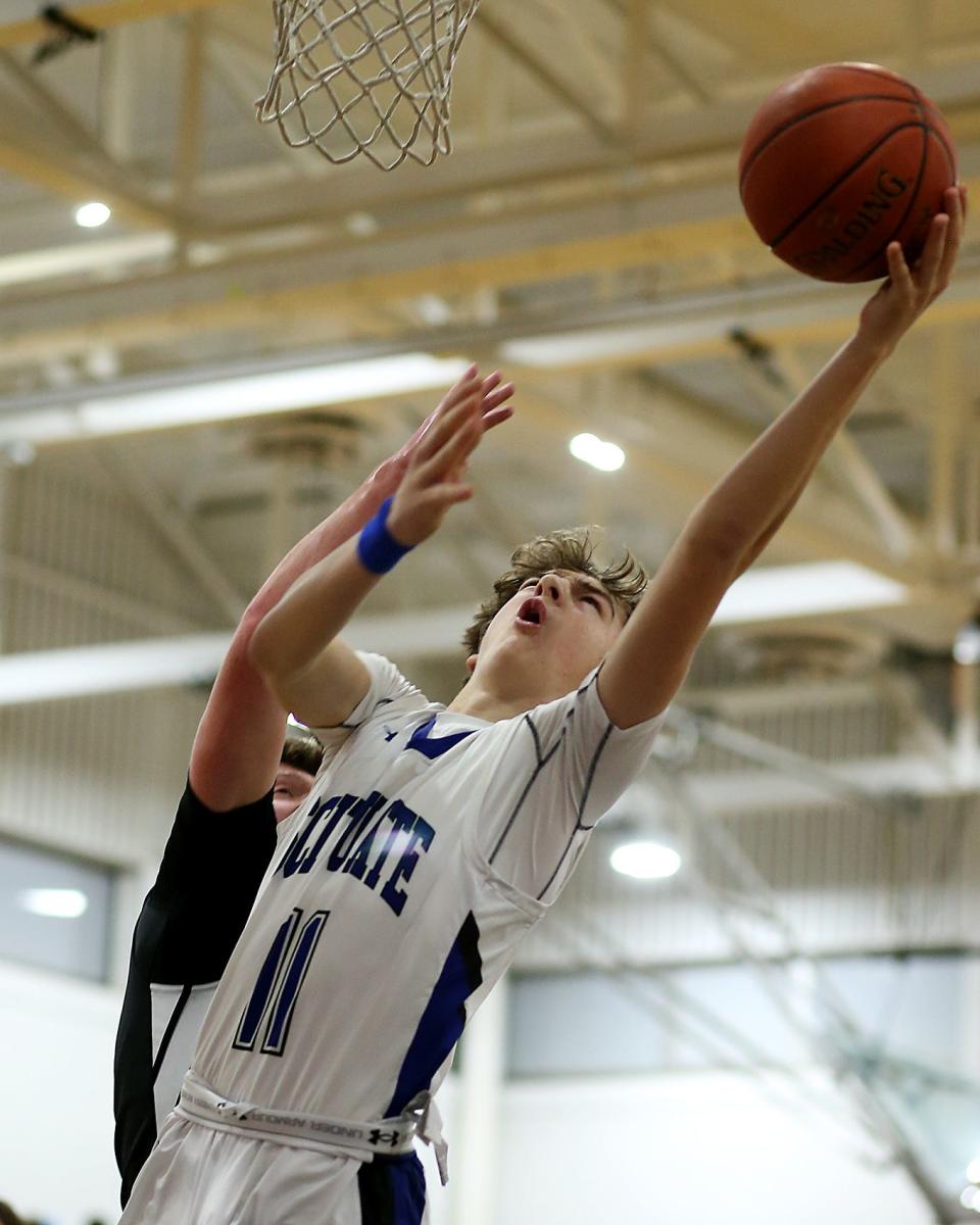 Scituate's Roman Glowac slices to the basket for two points to give Scituate the 9-4 lead over Middleborough during first quarter action of their game in the Round of 32 game in the Division 2 state tournament at Scituate High on Thursday, March 2, 2023.