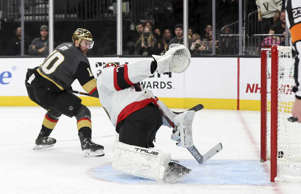 Vegas Golden Knights center Nicolas Roy (10) scores against Ottawa Senators goaltender Joonas Korpisalo, right, during the second period of an NHL hockey game Sunday, Dec. 17, 2023, in Las Vegas. (AP Photo/Steve Marcus)