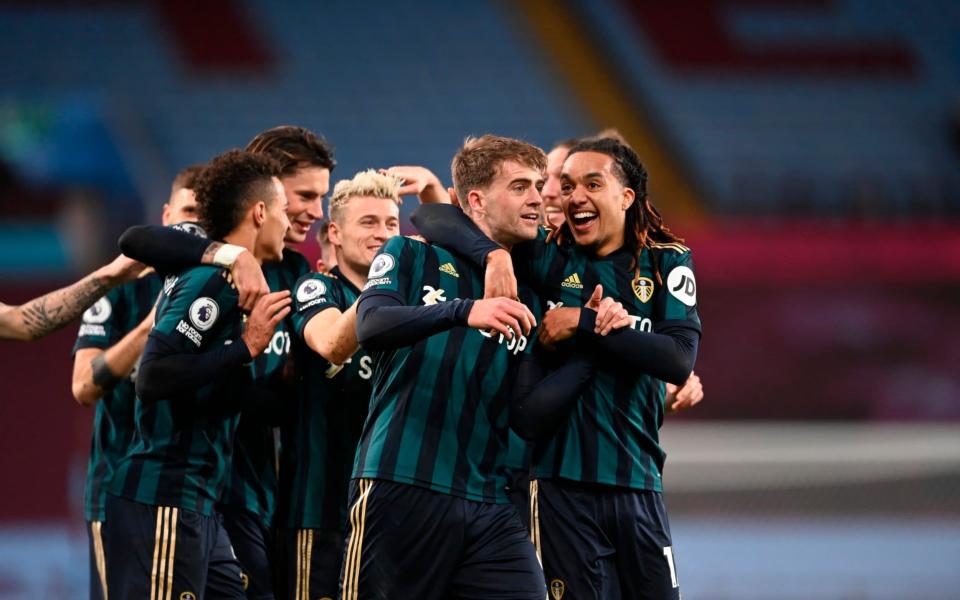 Leeds United's Patrick Bamford, 2nd right, celebrates with teamates his third goal during the English Premier League soccer match between Aston Villa and Leeds United  - AP