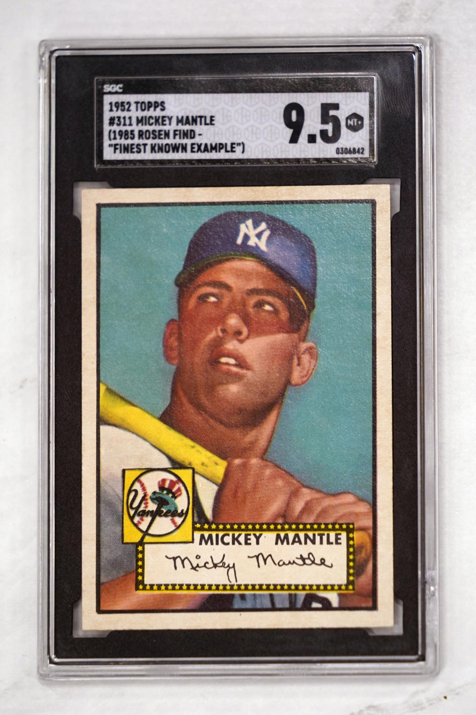 A Mickey Mantle baseball card is displayed at Heritage Auctions in Dallas, Thursday, July 21, 2022. The mint-condition Mantle card is expected to sell well into the millions when bidding ends at the end of the month. (AP Photo/LM Otero)