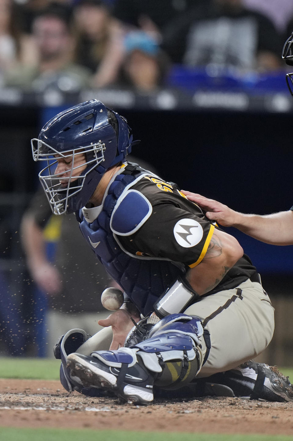 San Diego Padres catcher Gary Sanchez contains a pitch during the second inning of a baseball game against the Miami Marlins, Tuesday, May 30, 2023, in Miami. (AP Photo/Wilfredo Lee)