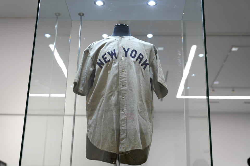 The 1932 Babe Ruth game worn New York Yankees World Series "Called Shot" jersey is displayed in a sealed glass box at Heritage Auction in Irving, Texas, Wednesday, Aug. 21, 2024. (AP Photo/LM Otero)